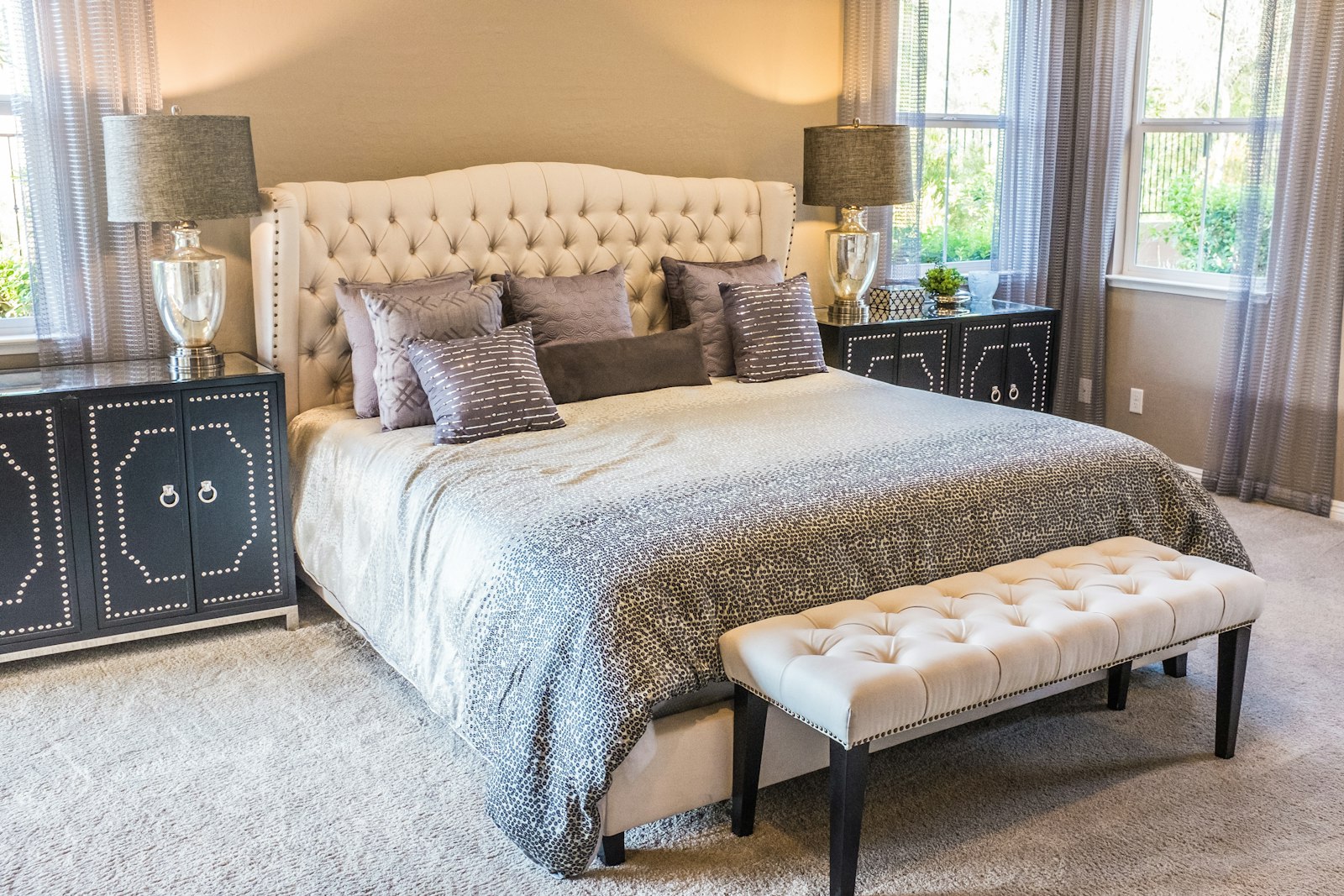Bedroom with a tufted headboard and upholstered bench